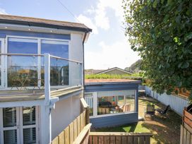 An outdoor view of a building with a balcony at Beachside in Polzeath