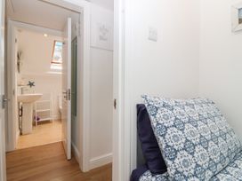 A bathroom with a sink and a toilet at Smugglers Loft in Looe