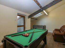 A recreation room with a pool table and a foosball table at Llofft Yr Yd Porthmadog