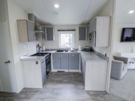 A kitchen with cabinets and appliances at Serendipity