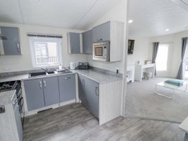 A kitchen with cabinets and appliances at Serendipity