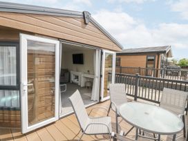 An outdoor area with a table and chairs at Serendipity