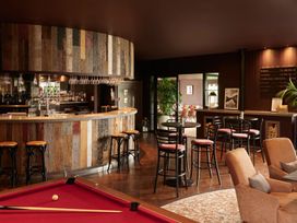 A snug with a bar and pool table at Cosy Corner in the Lakes Greystoke