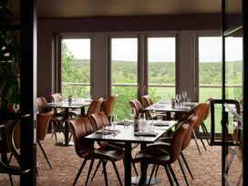 A dining room with tables and chairs at Cosy Corner in the Lakes Greystoke