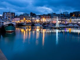 A harbor with boats and reflections in water at Trelowen St Issey near Padstow