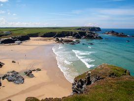A beach with waves and rocks at Trelowen in St Issey near Padstow