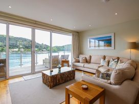 A living room with a sofa and coffee table at Villa 1, Estura in Salcombe