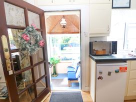 A kitchen with a microwave and fridge at Waterfall House Dunmanway, County Cork