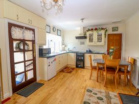 A kitchen with a table and chairs at Waterfall House in Dunmanway, County Cork