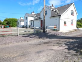 A house with a fence and gate at Waterfall House, Dunmanway, County Cork