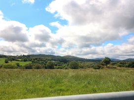 A landscape with hills and trees at Waterfall House Dunmanway, County Cork