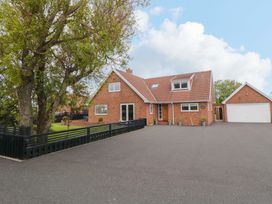 A house with a garage and driveway at Wyvill House in Cayton