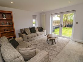 A living room with a sofa and coffee table at Wyvill House in Cayton