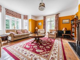A living room with a sofa and coffee table at High House in Southrepps