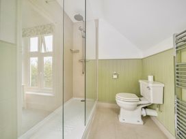 A bathroom with a shower and toilet at High House Southrepps