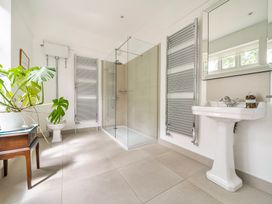 A bathroom with a shower and sink at High House in Southrepps