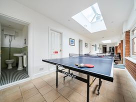 A games room with a ping pong table at High House in Southrepps