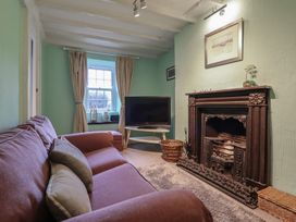 A living room with a sofa and television at Preswylfa in Ffestiniog
