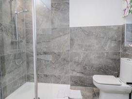 A bathroom with a shower and toilet at Hazelodge in Coniston