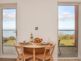 A dining room with a table and chairs at The Lookout in 