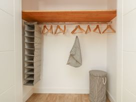 A closet with hangers and a fabric storage unit at The Lookout