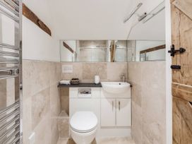A bathroom with a sink and toilet at Middle Dean Farmhouse near Trentishoe
