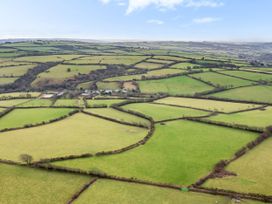 An aerial view of fields and a village area at Middle Dean Farmhouse, Trentishoe near Parracombe