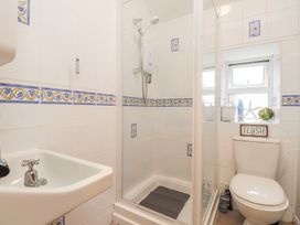 A bathroom with a shower and toilet at Menuchah in Criccieth