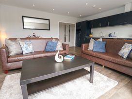 A living room with sofas and a coffee table at Durbyfield Nottington near Weymouth