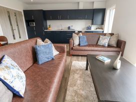 A living room with a sofa and coffee table at Durbyfield Nottington near Weymouth