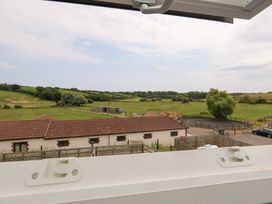 A view of fields and buildings from a window at Durbyfield in Nottington near Weymouth