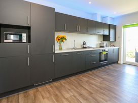 A kitchen with appliances and cabinetry at Overcombe Mill Nottington near Weymouth