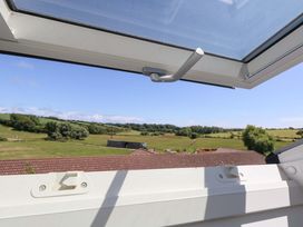 A view from a window showing fields and trees at Overcombe Mill Nottington near Weymouth