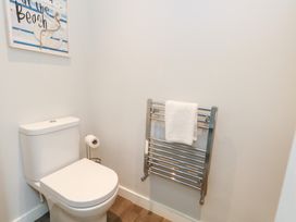 A bathroom with a toilet and towel radiator at Corvesgate in Nottington near Weymouth