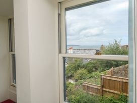 A view of the sea and garden from a window at Bay View in Brixham