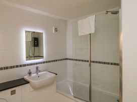 A bathroom with a shower and a sink at Bay View in Brixham