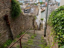 A staircase leading down to a road at Bay View in Brixham