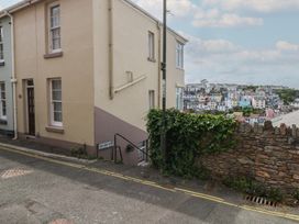 A street view of a residential building with steps at Bay View in Brixham
