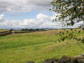 A landscape with grass and stone walls at Howgills Retreat Gatebeck near Kirkby Lonsdale