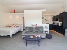 A living room with a bed and sofa at Ninky Nonk in Bristol