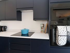 A kitchen with cabinets and a pot on the counter at Ninky Nonk in Bristol