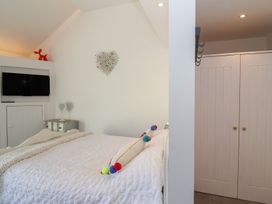 A bedroom with a bed and television at Ninky Nonk in Bristol