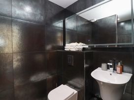 A bathroom with a sink and towels at Ninky Nonk in Bristol