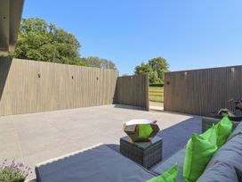 An outdoor area with seating and walls at Ninky Nonk in Bristol