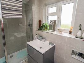 A bathroom with a shower and sink at Country Retreat in Ponteland