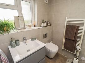 A bathroom with a vanity and toilet at Country Retreat in Ponteland