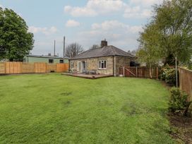 A house with a garden and deck at Country Retreat in Ponteland