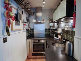A kitchen with various appliances and fixtures at Seaside, Lyme Regis