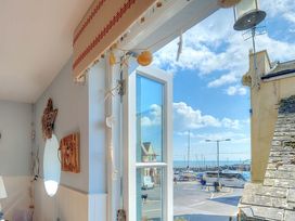 A view from a window showing boats and a street at Seaside Lyme Regis