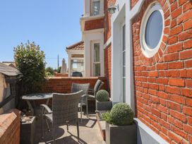 An outdoor area with a table and chairs at Seaside in Lyme Regis
